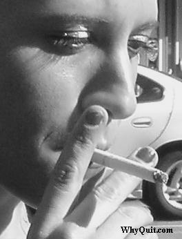 Picture of a female smoker puffing on a cigarette