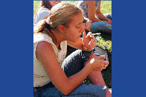 A  Western Carolina University student smoking nicotine while listening to a band during an October 4, 2004 student voter registration drive.