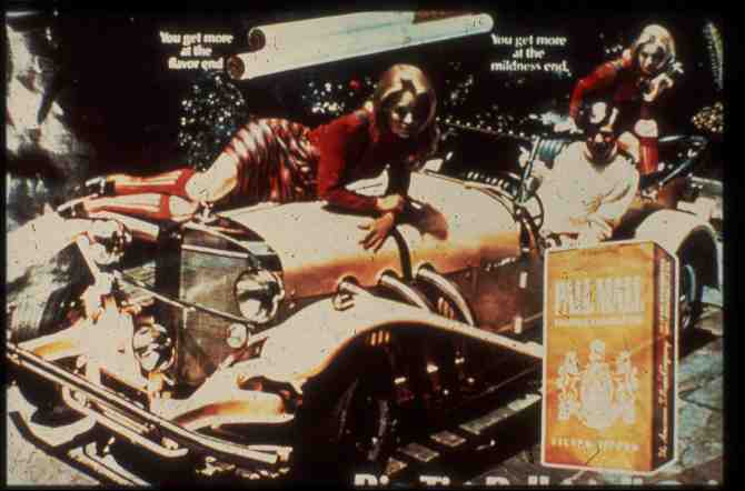A Pall Mall cigarettes advertisement with two girls atop an old car