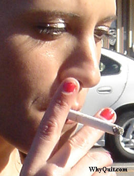 smoker taking a puff off of a cigarette