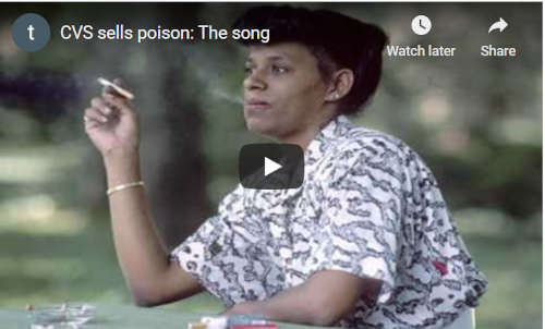 Video screenshot of a woman holding a cigarette with the caption CVS sells poison