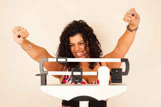picture of woman excited smoking cesssation weight control. Photo courtesy of the U.S. NCI.