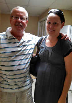 Photo of Jim Heusi with his arm around his daughter Jenna.