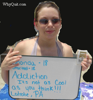 Photo of 18 year-old Rhonda, a Marlboro smoker who started smoking at age 12.  Rhonda is at the beach holding a message which reads, 'addiction is not as cool as you think.'