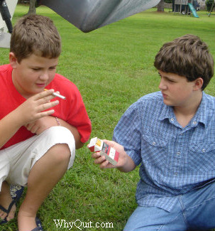 Staged photo of two brothers, Kevin and Sean, simulating the sharing of that first cigarette ever.