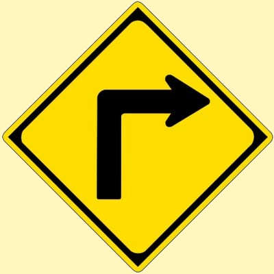 Yellow road turning corner road sign on light yellow background.