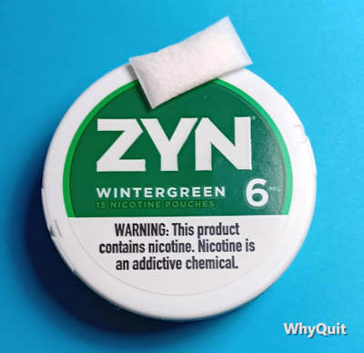 Photo of a Zyn Wintergreen 6mg. nicotine pouch can with a single white pouch atop the can.