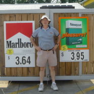 Click to enlarge this August 8, 2009 image of John R. Polito standing in front of convenience store Marlboro and Newport signs in Ladson, SC