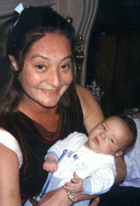 Noni holding her 3 month old son